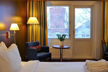 Фото номера Улучшенный номер с кроватью размера «king-size» Отель Hotel Kalliohovi г. Раума 9