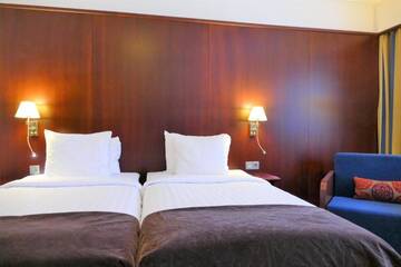 Фото номера Стандартный двухместный номер с 2 отдельными кроватями Отель Hotel Kalliohovi г. Раума 6
