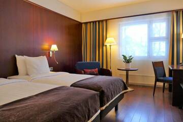 Фото номера Стандартный двухместный номер с 2 отдельными кроватями Отель Hotel Kalliohovi г. Раума 7
