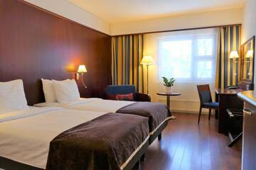Фото номера Стандартный двухместный номер с 2 отдельными кроватями Отель Hotel Kalliohovi г. Раума 5