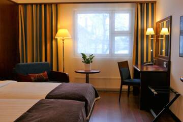 Фото номера Стандартный двухместный номер с 2 отдельными кроватями Отель Hotel Kalliohovi г. Раума 8