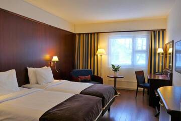 Фото номера Стандартный двухместный номер с 2 отдельными кроватями Отель Hotel Kalliohovi г. Раума 9