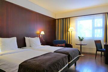 Фото номера Стандартный двухместный номер с 2 отдельными кроватями Отель Hotel Kalliohovi г. Раума 10