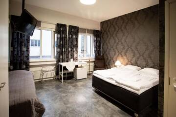 Фото номера Семейный номер (для 2 взрослых и 1 ребенка) Отель Hotel CityHovi г. Раума 6